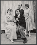 Justine Johnston [seated left], Phil Leeds [seated right], Claiborne Cary [standing right] and unidentified [standing left] in the stage production Smiling the Boy Fell Dead