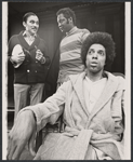 Edward Seamon [standing left], Dennis Tate [seated] and unidentified [standing center] in the stage production Underground