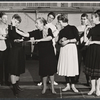 Choreographer Hanya Holm (center holding dancer's arm) and dancers in rehearsal for the stage production Anya