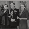 Maurice Evans (center) and unidentified cast members in the stage production The Apple Cart