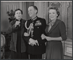 Maurice Evans (center) and unidentified cast members in the stage production The Apple Cart