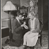 Donald Harron [kneeling], Phyllis Neilson-Terry [standing] and unidentified [seated] in the stage production Separate Tables