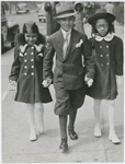 Church is out: Edward Jones (center) escorting Pat Roberts and Edna Dean home from church, Harlem, New York City