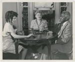 Philippa, Josephine and George Schuyler at home, playing dominoes, circa mid-1940s.