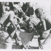Paratrooper from the 101st Airborne Brigade applying mouth-to-mouth resuscitation to an injured soldier who was airlifted by helicopter to the medical clearing station near Kontum, Vietnam