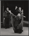 Raymond Massey [left], Christopher Plummer [background with one hand up] and unidentified [with arms up] in the stage production J.B.