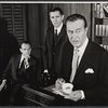 Ray Milland [right] and unidentified others in the stage production Hostile Witness