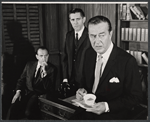 Ray Milland [right] and unidentified others in the stage production Hostile Witness