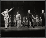 Tony Roberts [at left] and unidentified others in the stage production How Now Dow Jones