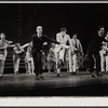 Tony Roberts [right of center in light suit] and unidentified others in the stage production How Now Dow Jones