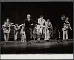 Tony Roberts [right of center, in light suit] and unidentified performers in the stage production How Now Dow Jones