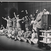 Charles Nelson Reilly [right] and ensemble in the stage production How to Succeed in Business Without Really Trying
