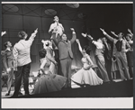 Charles Nelson Reilly [top] and ensemble in the stage production How to Succeed in Business Without Really Trying