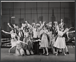 Ralph Purdum, Claudette Sutherland and ensemble in the stage porduction How to Succeed in Business Without Really Trying