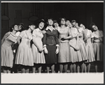 Michele Lee [center] and ensemble in the stage production How to Succeed in Business Without Really Trying