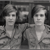 Twins with "Boy Scouts of America" on shirt