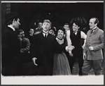 Tommy Steele (center), James Grout (far right), and company in the stage production Half a Sixpence