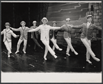 Dick Kallman (center) and company in the stage production Half a Sixpence