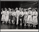 Dick Kallman (center) and company in the stage production Half a Sixpence