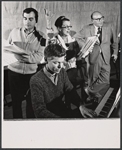 Book writer and composer Hugh Martin (at piano), Beatrice Lillie, and unidentified men in rehearsal for the stage production High Spirits