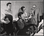 Book writer and composer Hugh Martin (at piano),  Beatrice Lillie, and unidentified men in rehearsal for the stage production High Spirits