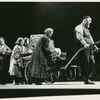 Zero Mostel in the stage production of Fiddler on the Roof as Tevye (pulling cart with family behind him)