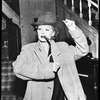 Lucille Ball in the television production I Love Lucy (bowler hat and cigar).