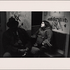 Man in Black Hat, Young Woman in Duffel Coat - Sitting in Corner Seat