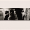 Train Passing Two Men in Profile, Black and Hispanic: Woman in Scarf and Crochet Hat
