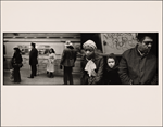 Four People on Platform - Train Conductor in Cap, Man in Sports Hat - Train Passing: Woman with White Headscarf, Frightened Little Girl, Hispanic Man in Check Coat - Seated