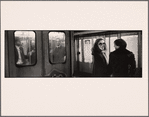 Three Men Inside Car, One Facing Camera Through Window: Couple at Platform, Woman with Glasses and Long Hair Smiles at Camera, Partner Looks Toward Her