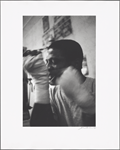 Series # 20 [Man tying bandage around wrist with teeth]