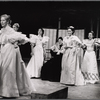 Carol Jo Lugenbeal (left), Raul Julia (seated), and others in the stage production Where's Charley?