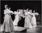 Carol Jo Lugenbeal (left), Raul Julia (seated), and others in the stage production Where's Charley?