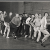 Arik Lavie [center] and ensemble in rehearsal for the stage production Irma La Douce