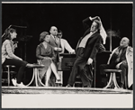 Alec Guiness [center] and ensemble in the stage production Dylan