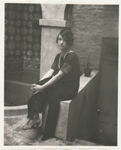Dorothy Parker in backyard of residence at 412 West 47th Street, New York City.