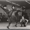 Director-choreographer Michael Kidd (crouching) and two unidentified dancers in rehearsal for the stage production Destry Rides Again