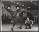 Director-choreographer Michael Kidd (crouching) and two unidentified dancers in rehearsal for the stage production Destry Rides Again