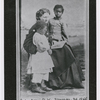 Portrait of Sea Island School teacher Miss Harriet W. Murray, with students Elsie and Puss