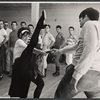 Chita Rivera, Gus Trikonis, and male dancers during rehearsal for the stage production Bajour