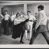 Chita Rivera, Gus Trikonis, and male dancers during rehearsal for the stage production Bajour