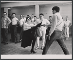 Chita Rivera, Gus Trikonis, and male dancers during rehearsal for the stage production Bajour