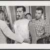 Robert Goulet being fitted for her costume for the stage production Camelot