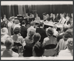 Frederick Loewe [at piano], Alan Jay Lerner [dark glasses], Moss Hart [center table] and ensemble in rehearsal for the stage production Camelot