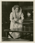 Helen Menken (as Queen Elizabeth) plays ping pong backstage during production of Mary of Scotland
