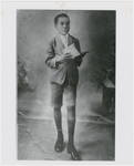 Portrait of Léon-Gontran Damas as a youth, about age nine, holding a book, circa 1921