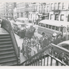 View of two busloads of Catholic school children arriving for class at St. Charles Borromeo Church, on West 142nd Street, in Harlem, New York City, circa late 1940s