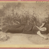 Full-length studio portrait of Loie Fuller as Ustane in her death scene in H. Rider Haggard's "She".