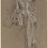 Young woman, standing, reading a letter
